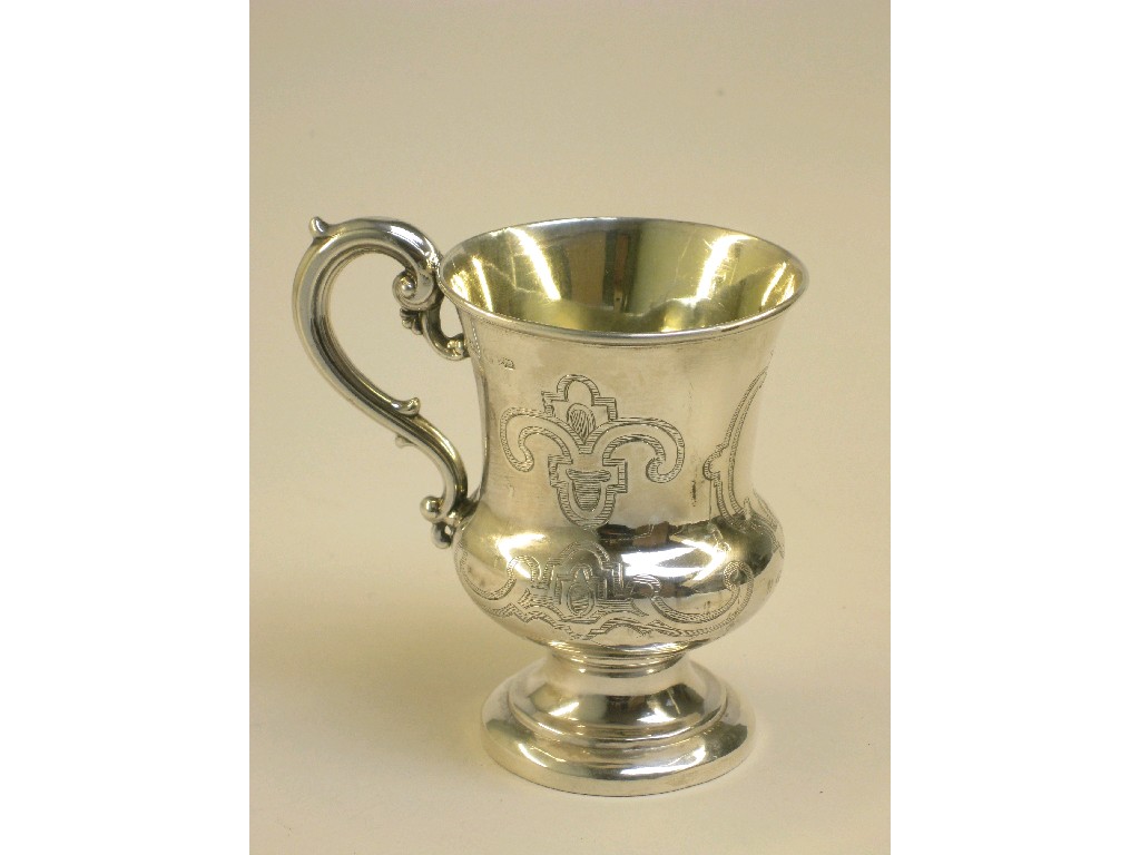 Appraisal: A Victorian Christening Mug with strap work engraving and vacant