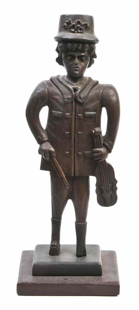 Appraisal: A Folk Art Carved Wood Figure depicting a standing male