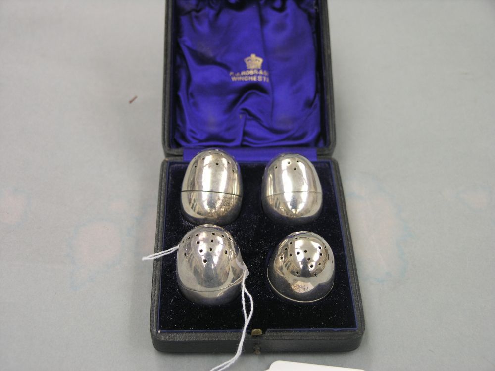 Appraisal: A set of four silver plated peppers egg shape in