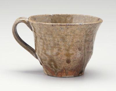 Appraisal: Stoneware cup strap handle runny olive alkaline glaze - in