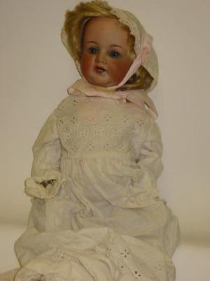 Appraisal: An Armand Marseille bisque head character girl doll with blue