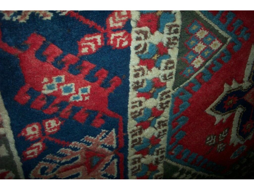 Appraisal: An Eastern wool rug with hooked and geometric decoration in