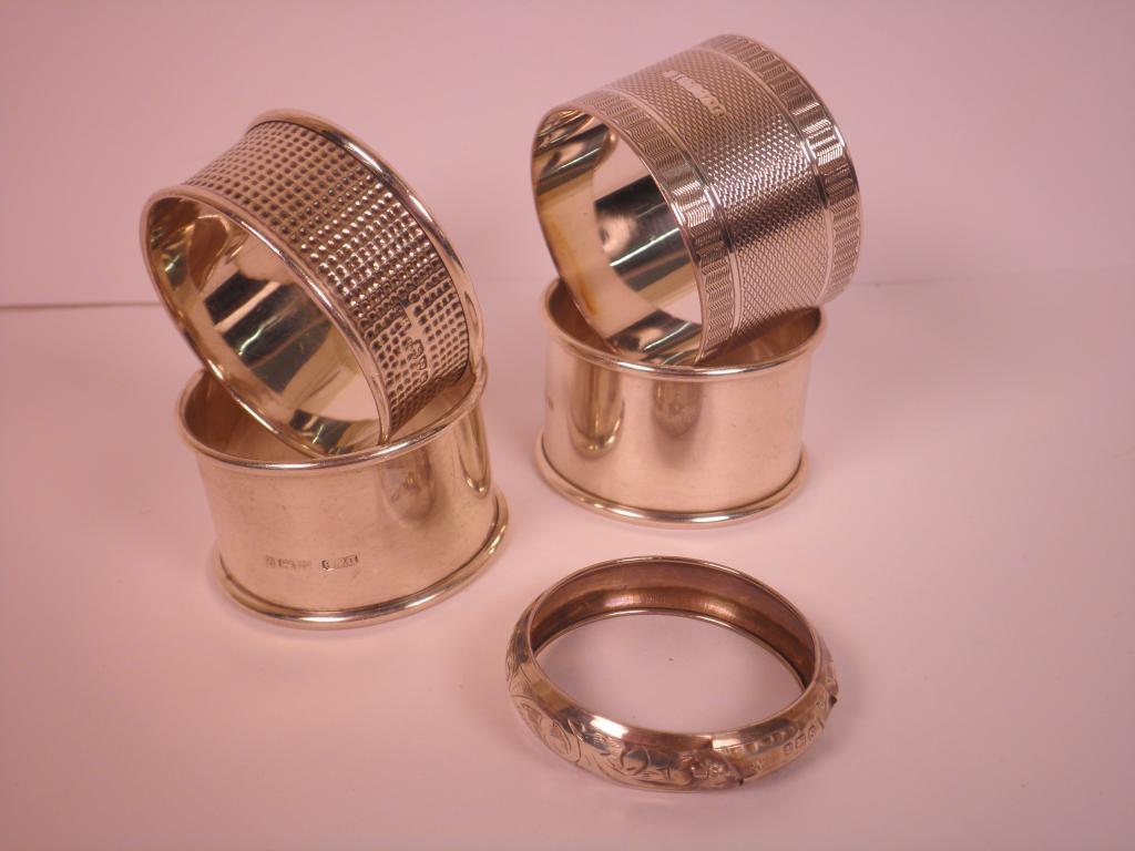 Appraisal: Five various silver napkin rings