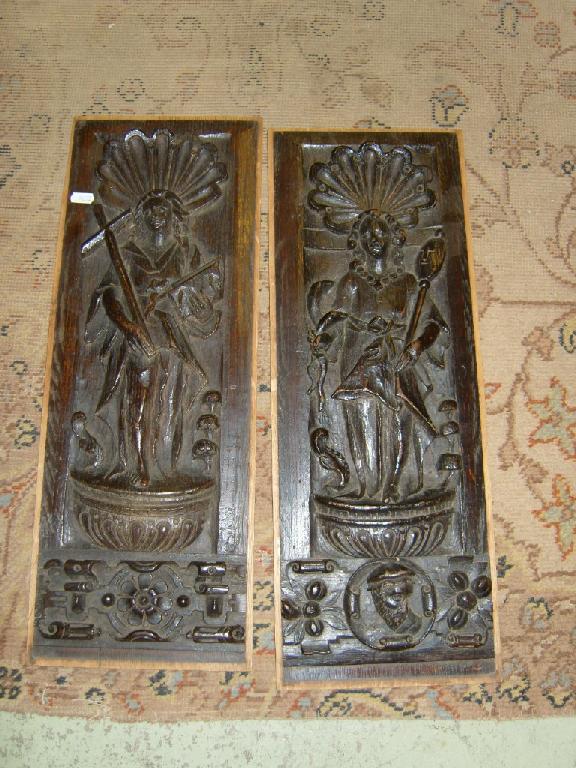 Appraisal: A near pair of period oak panels depicting Saints with