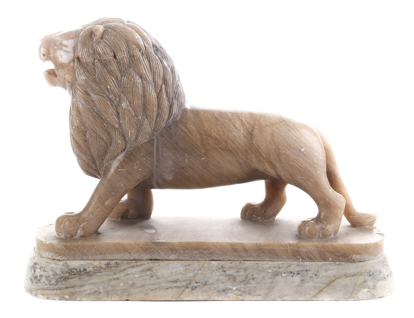 Appraisal: Chinese carved hardstone prowling lion in H Condition Natural fissures