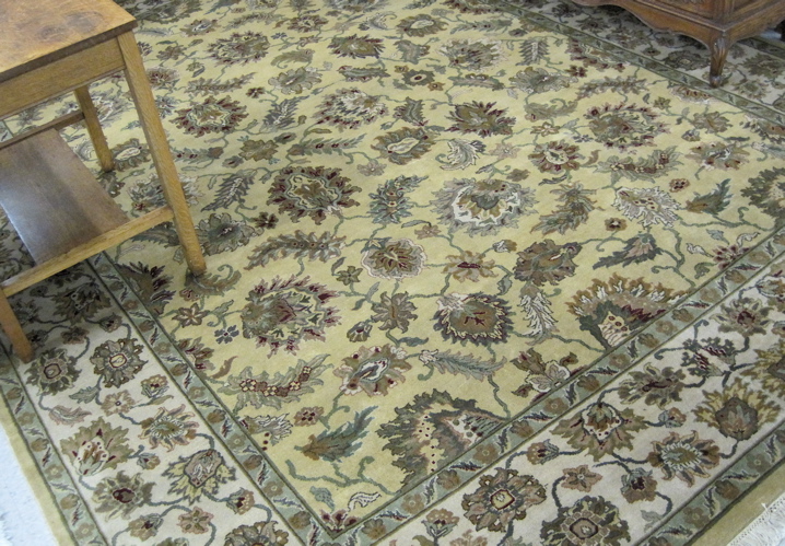 Appraisal: HAND KNOTTED ORIENTAL CARPET Indo-Persian overall floral decorated light yellow