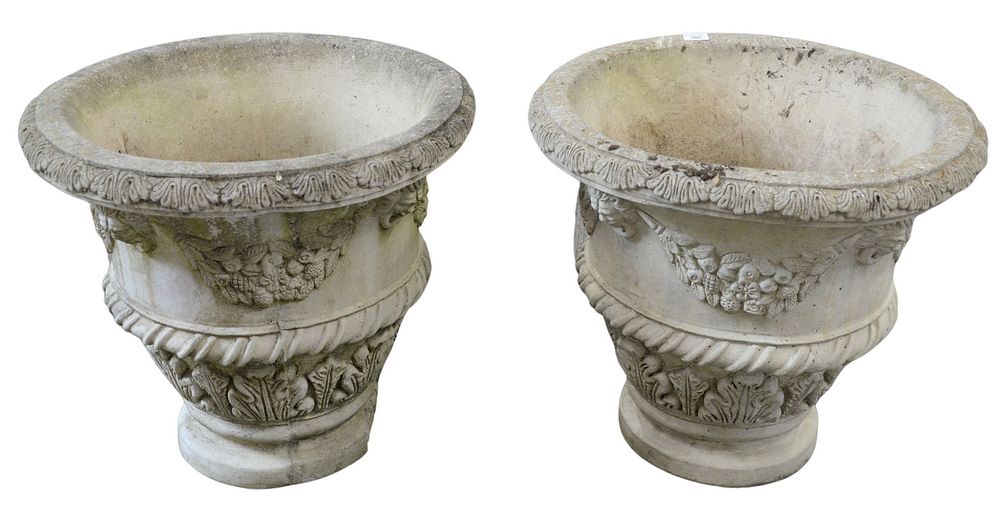 Appraisal: Pair of Concrete Urns with faces and wreaths signed Nina