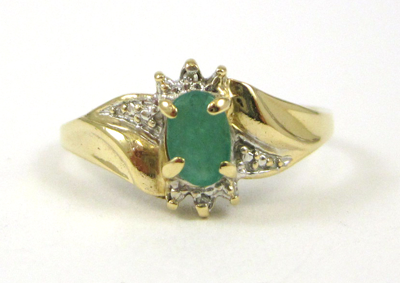 Appraisal: EMERALD DIAMOND AND TEN KARAT GOLD RING set with two