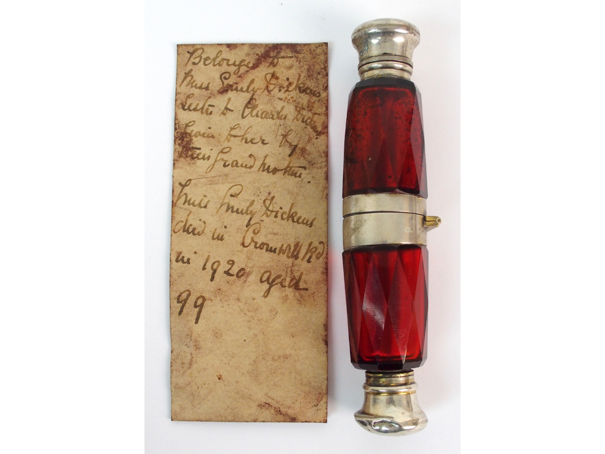 Appraisal: A white metal mounted cranberry glass doubled ended scent bottle