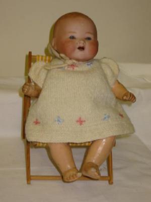 Appraisal: An Armand Marseille bisque head baby doll with blue glass