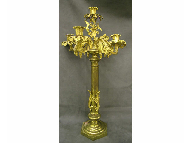 Appraisal: Cast metal and brass five-branch candelabra with metal-leaf gold finish