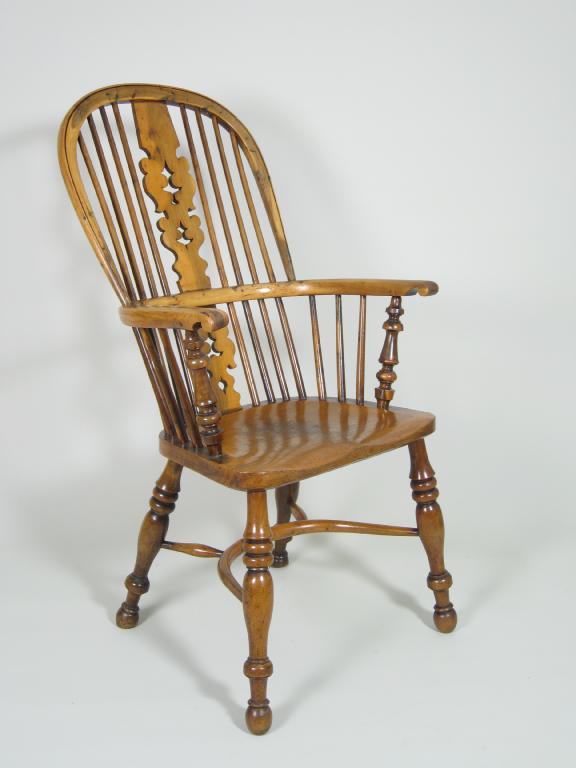 Appraisal: A th century yew wood Windsor Elbow Chair with pierced