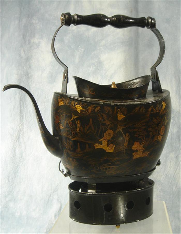 Appraisal: Lacquer decorated tin teapot on warming base swing wood handle