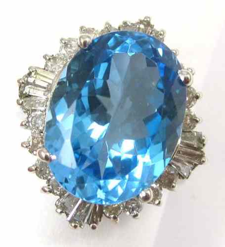 Appraisal: BLUE TOPAZ AND FOURTEEN KARAT GOLD RING with round-cut and