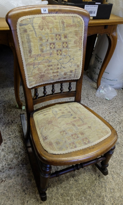 Appraisal: An Edwardian walnut upholstered rocking chair