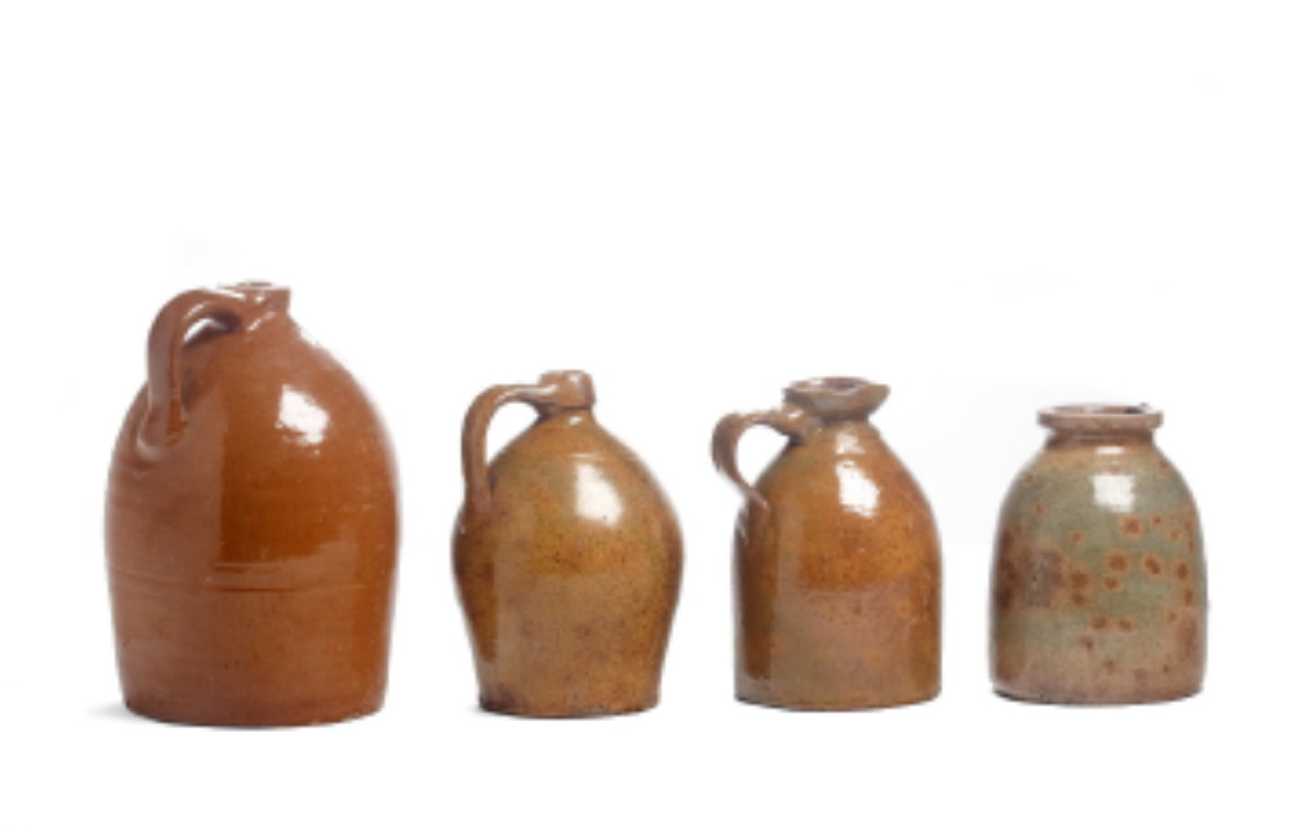 Appraisal: THREE NEW YORK GLAZED REDWARE JUGS AND A CROCK NINETEENTH