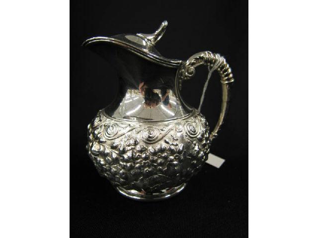 Appraisal: Victorian Silverplate Syrup Pitcher rococo floral repousse excellent