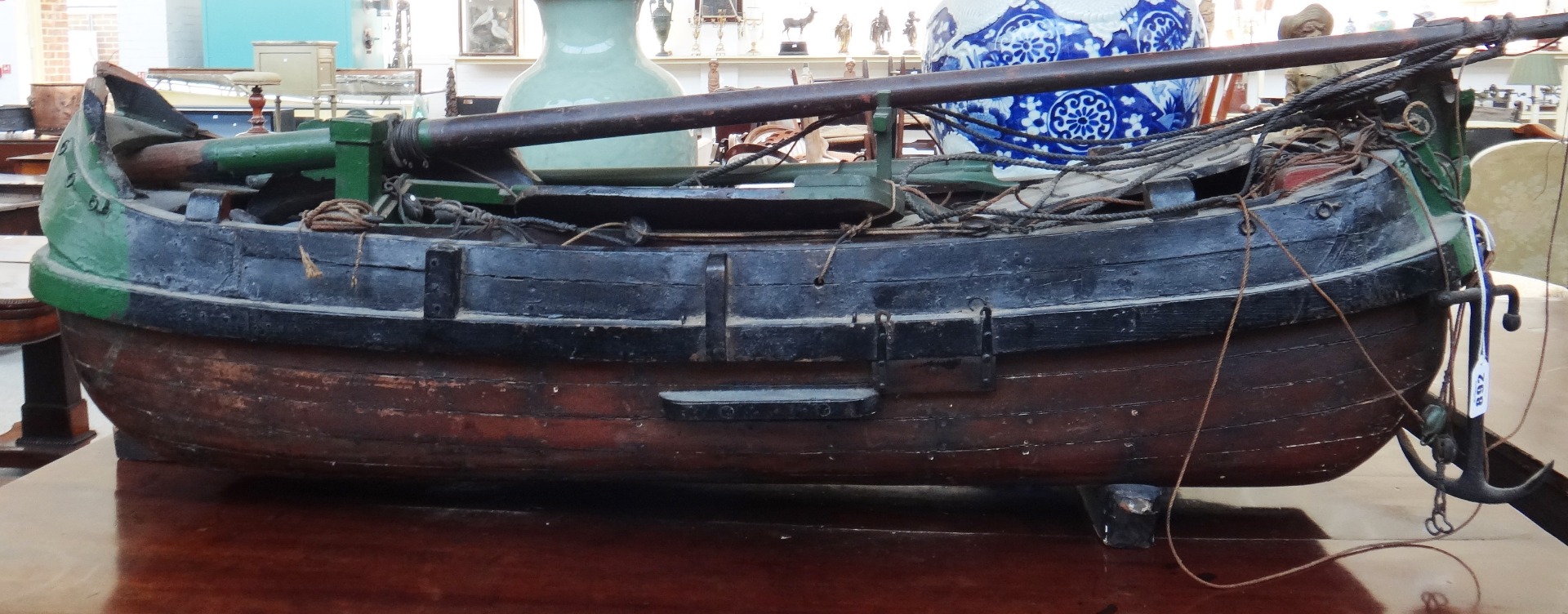 Appraisal: An early th century wooden model of a Thames barge