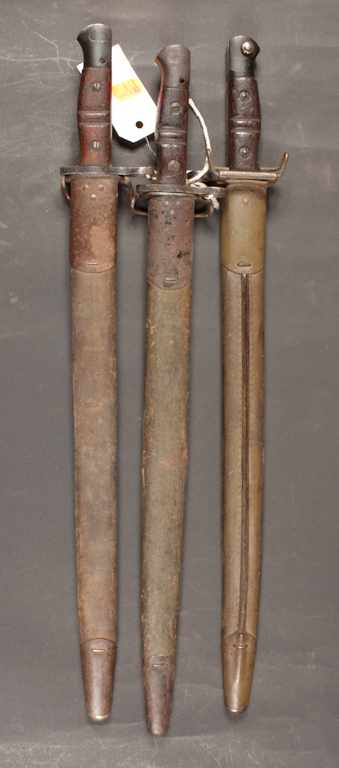 Appraisal: Three bayonets Two Remingtons with scabbards and a with scabbard