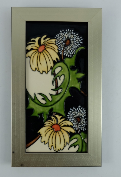 Appraisal: Moorcroft tile decorated in the Daisy May design in frame