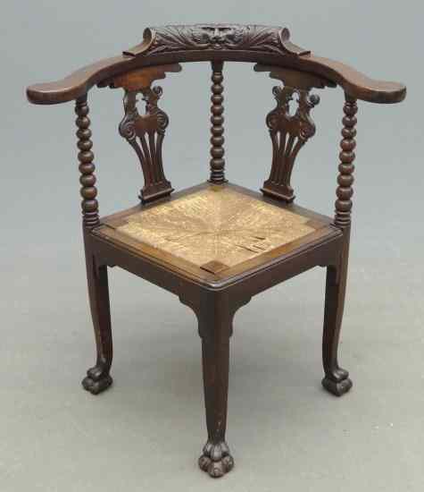 Appraisal: Victorian rush seat corner chair with Northwind carving on crest