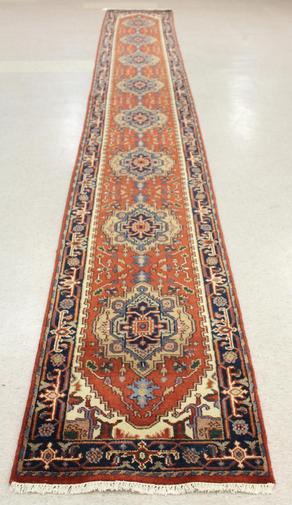 Appraisal: HAND KNOTTED ORIENTAL RUNNER Indo-Persian Serab design featuring eight geometric