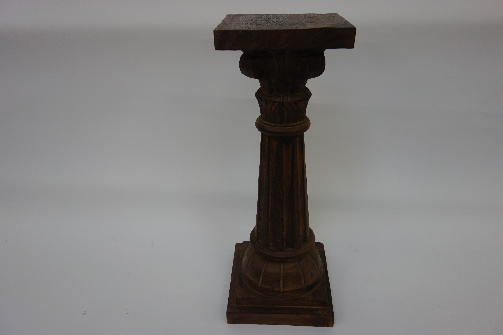 Appraisal: A reproduction mahogany carved lobed and fluted classical column with