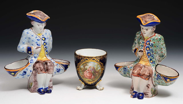 Appraisal: A pair of faience saltseach in the form of a