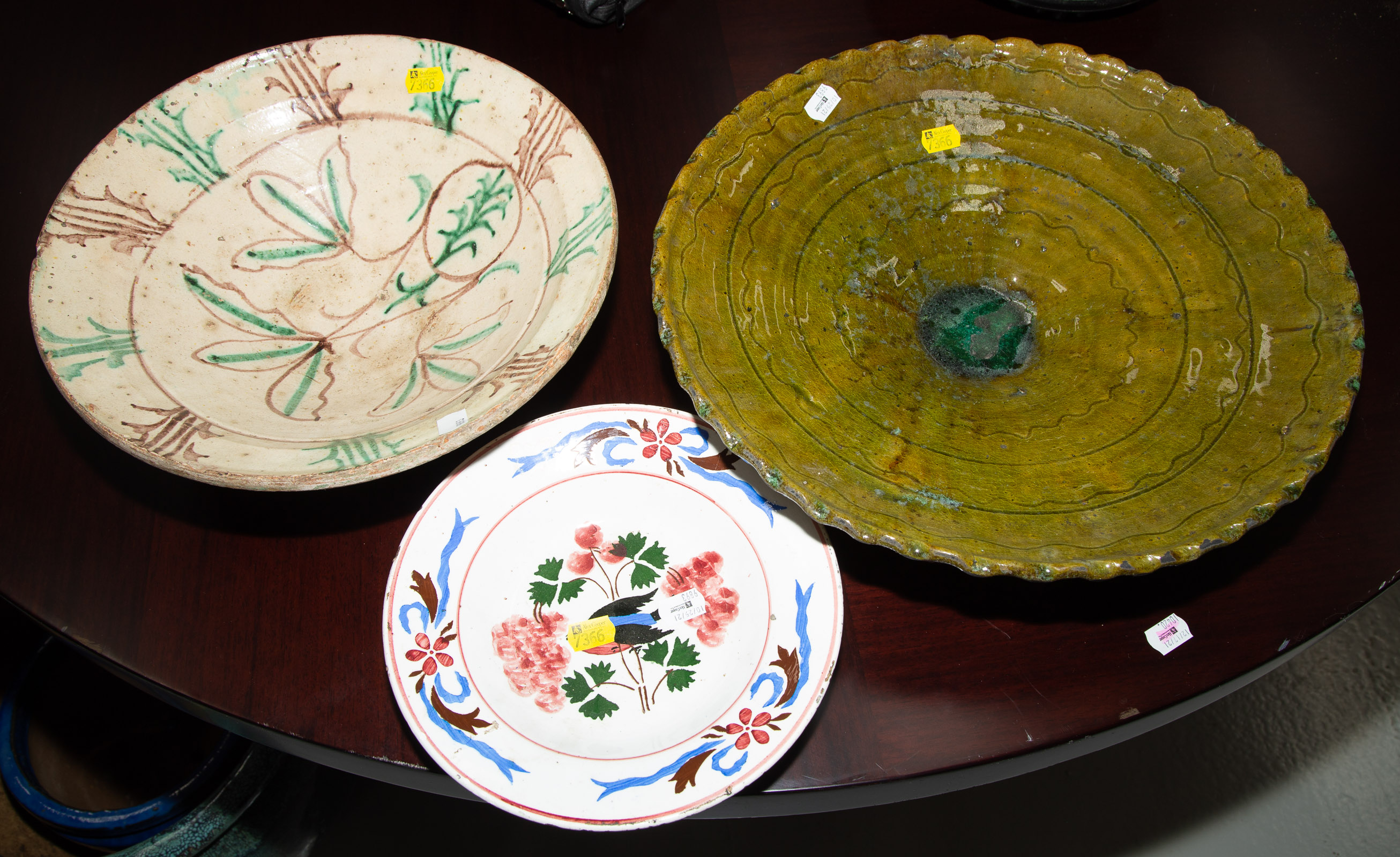 Appraisal: THREE ANTIQUE ANTIQUE STYLE BOWLS Including a large Turkish serving