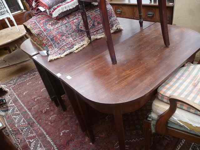 Appraisal: A GEORGIAN MAHOGANY 'D' END DINING TABLE standing on square