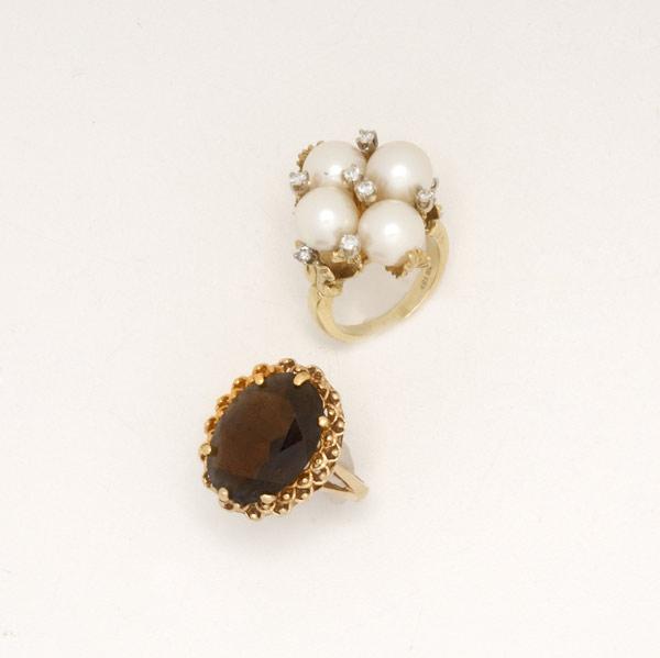 Appraisal: GOLD AND GEMSTONE RINGS Ca Akoya pearl quatrefoil and diamond