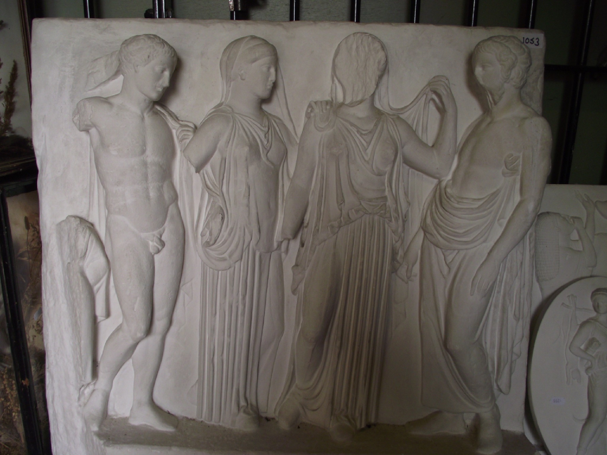 Appraisal: Three decorative moulded plaster friezes tablets with classical figural relief