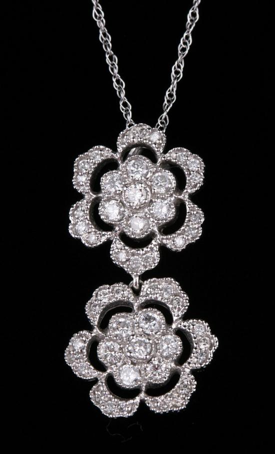 Appraisal: K WHITE GOLD AND DIAMOND FLORAL DESIGN PENDANT ON CHAIN