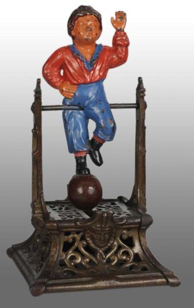 Appraisal: Cast Iron Boy on Trapeze Mechanical Bank Description American Manufactured