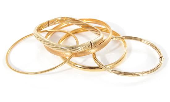 Appraisal: Italian gold bangles K gold hinged and solid marked and