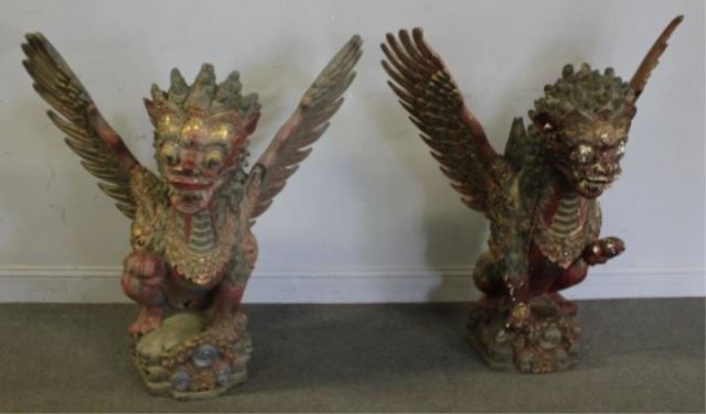 Appraisal: Pair of Antique Balinese Carved and PolychromedWinged Temple Figures From