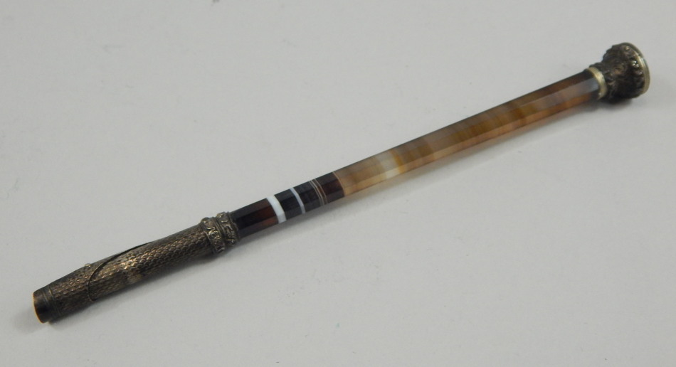 Appraisal: A Victorian quill pen with a banded agate handle the