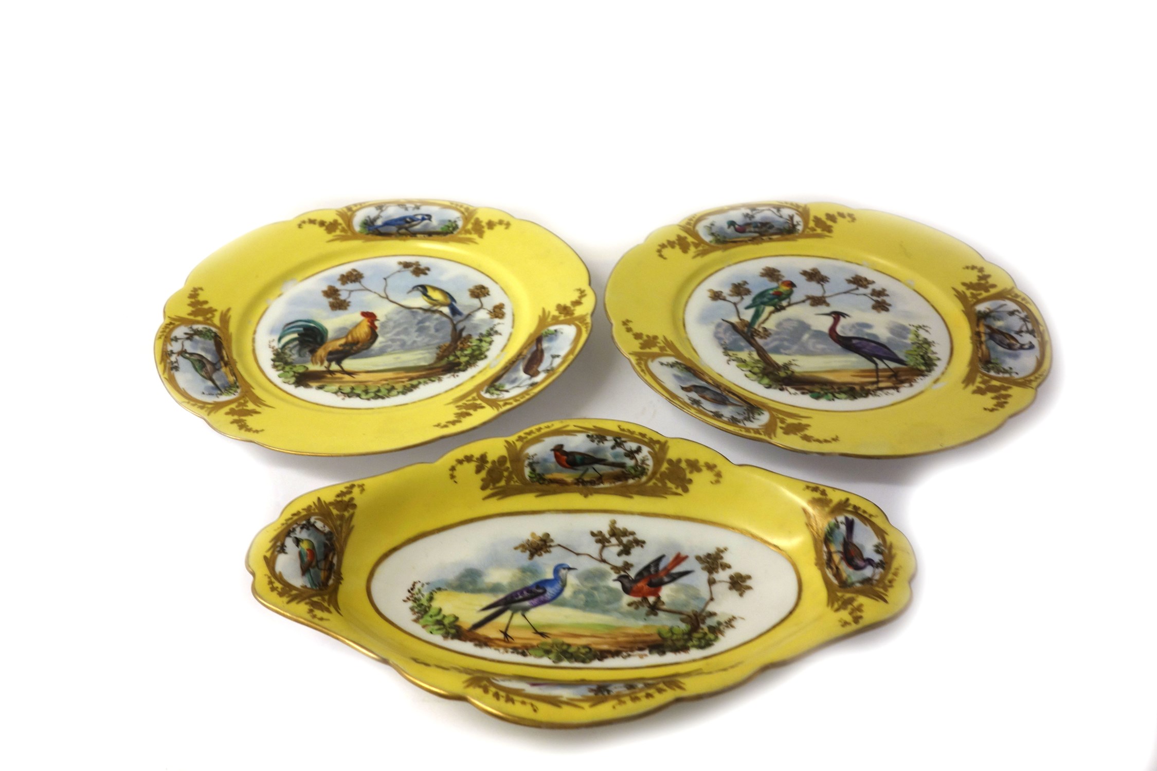 Appraisal: Two French porcelain plates and a matching oval dish late