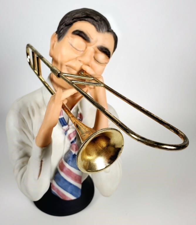 Appraisal: Large hand painted porcelain bust of a man playing Trombone