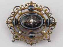 Appraisal: A yellow metal tests carat gold Victorian brooch the central