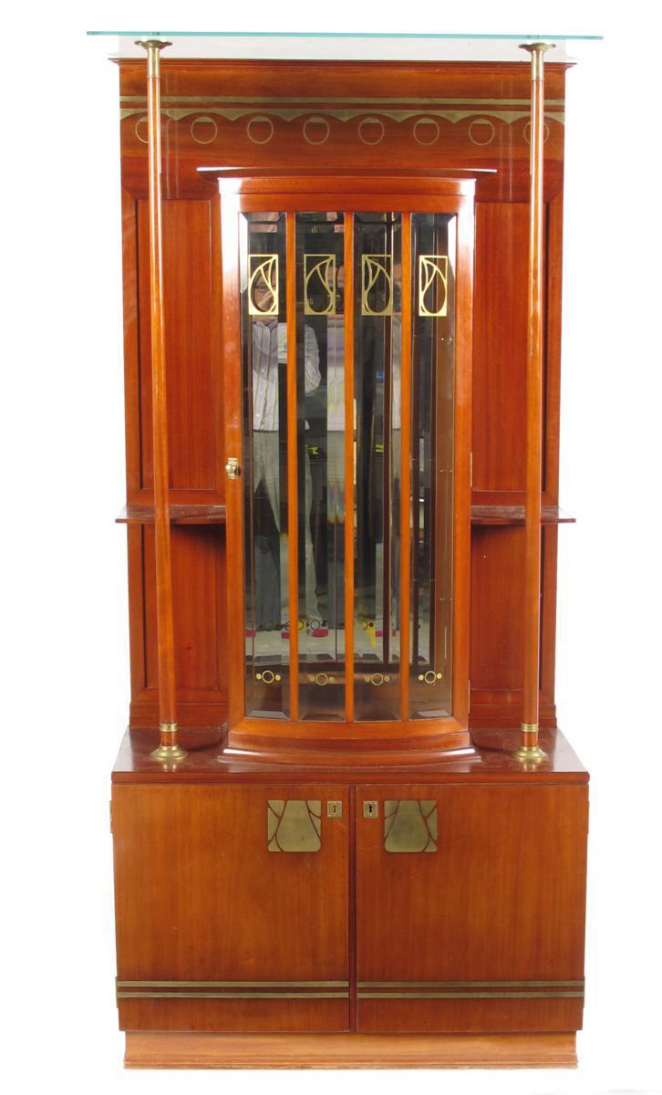 Appraisal: A Darmstadt mahogany and brass inlaid display cabinet