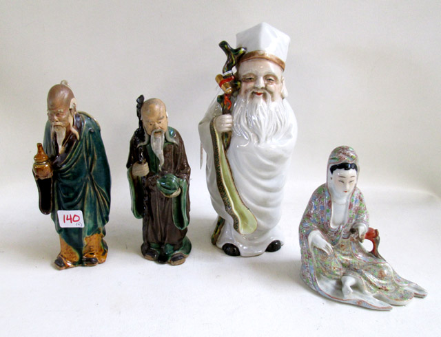 Appraisal: FOUR CHINESE QING EARTHENWARE FIGURES consisting of two standing mud