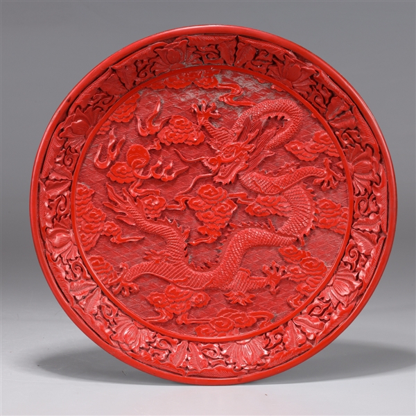 Appraisal: Chinese red lacquer-like dish the circular form boldly executed with