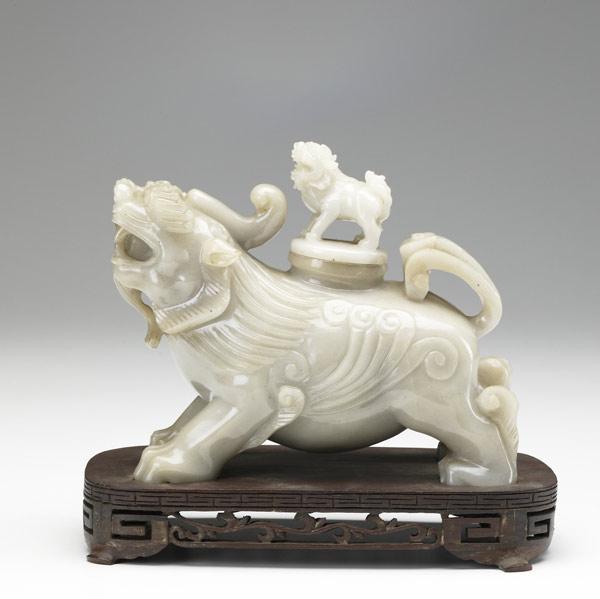 Appraisal: Jade carving of a Foo dog th th C With