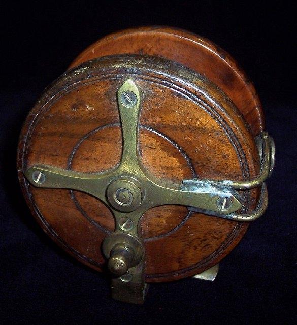 Appraisal: A Nottingham star back fishing reel with ring line guide