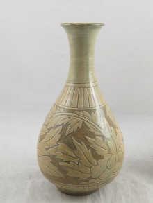 Appraisal: An oriental vase with cream floral decoration possibly Korean cm