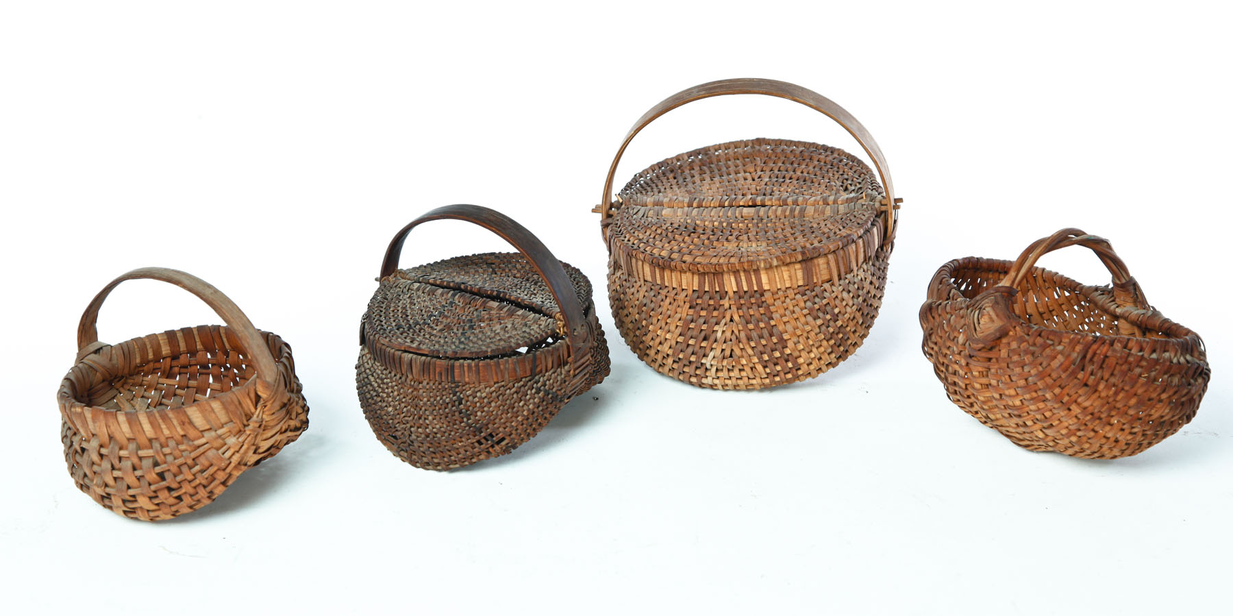 Appraisal: FOUR MINIATURE BASKETS American late th-early th century woven splint