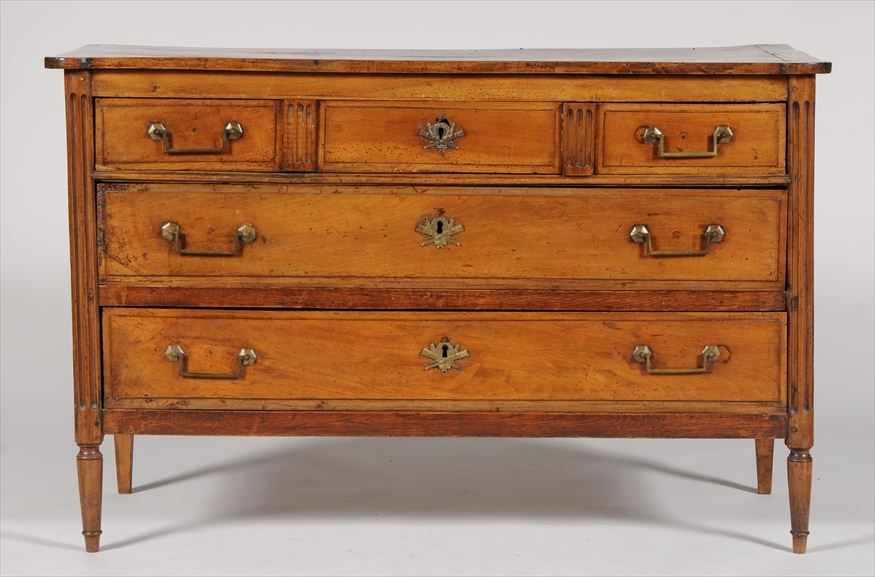 Appraisal: LOUIS XVI WALNUT COMMODE The solid top above a case