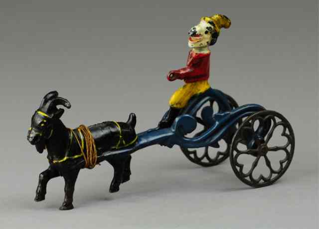 Appraisal: PUNCH RIDING GOAT CART Cast iron colorfully painted Punch figure