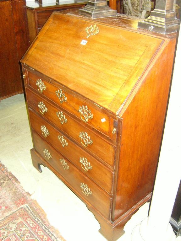 Appraisal: A small Georgian mahogany bureau the fall front enclosing a